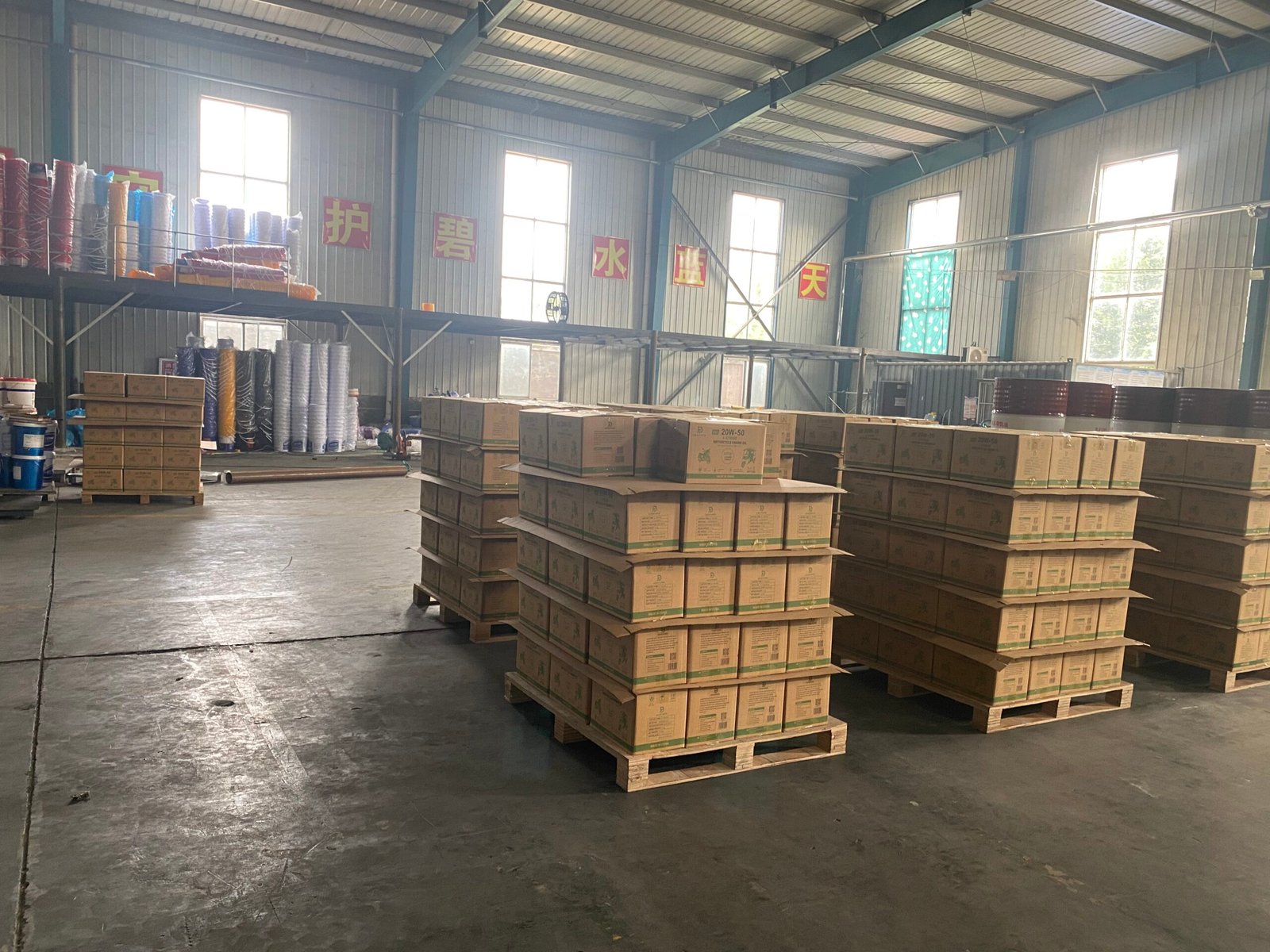 Packed lubricant orders on pallets inside the BAKLUCK OEM production facility